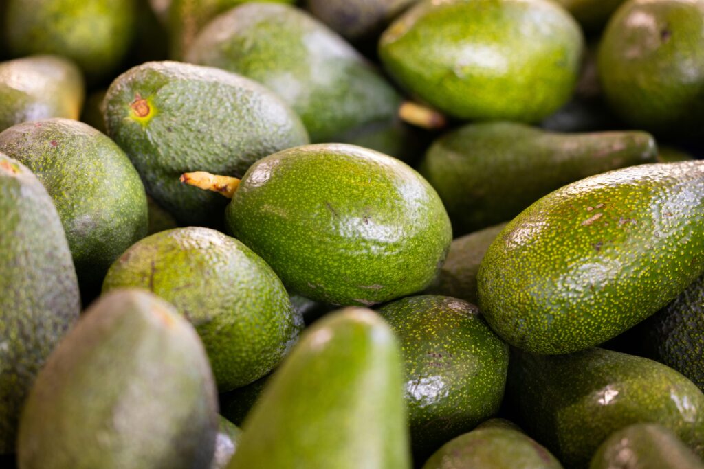Discover fresh organic avocados piled together. Perfect for healthy diets and delicious meals.